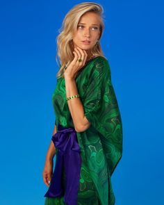 Crafted from beautifully draping silk, our Regina Belted Silk Kaftan feels incredibly sensuous and soft. A subtle sheen highlights the flutter of every movement. At once bold and mysterious, our Regina Belted Kaftan in Precious Malachite conveys a jolt of the hypnotic deeply rich green stone that has captivated so many civilizations, from the Egyptians to the Aztecs and the Europe, across a vast breadth of time. The Egyptians bestowed malachite with powers to ward off evil, while Faberge showcas Purple Sash, The Aztecs, The Europe, Short Kaftan, Casual Luxe, Smaller Waist, Silk Kaftan, Purple Accents, Sash Belts