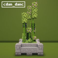 an image of a plant made out of lego blocks and flowers on top of it