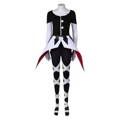 a woman dressed in black and white with red accents is standing on a mannequin