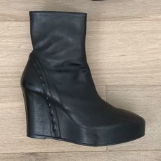 Ann Demeulemeester Black 125 Wedge Leather Ankle Boots With Stud Detail Size 41eu Retail $1340 Made In Italy Excellent Used Condition, Like New Comes With Original Box Black Leather 125mm Wedge Ankle Boots From Ann Demeulemeester Featuring Round Toe, Side Zip Fastening, Ankle-Length And High Wedge Heel. Unique Stud Detail Lining Heel These Black Ann Demeulemeester 125 Wedge Leather Ankle Boots Are Crafted In Italy With Almond Toes, Side Zip Fastenings And 125 Mm Wedge Heels. 5 Inch Heel With 1 Inch Platform Black Leather Wedge Boots With Sculpted Heel, Leather High Heel Wedge Boots With Sculpted Heel, Formal Leather Wedge Boots With Reinforced Heel, Formal Wedge Heel Platform Boots, Leather Wedge Boots With Sculpted Heel And Round Toe, Formal Medium Width Boots With Wedge Heel, Leather Wedge Boots With Pointed Toe For Evening, Leather High Heel Wedge Boots For Evening, Elegant Wedge Boots With Platform And Round Toe