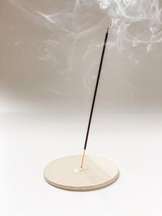 Enjoy the calming effects of aromatherapy with this minimalist, round Incense Holder featuring a unique and subtle two-tone design.  Wheel-thrown with a speckled stoneware clay, this ceramic incense plate showcases a beautiful contrast between its finishes: two-thirds glossy for a sleek, polished look, and one-third exposed raw clay with a soft, matte texture. This modern, minimalist design brings a sophisticated and calming touch to any room, perfect for aromatherapy and meditation. Ideal for h Speckled Stoneware, Ceramic Incense, Burning Incense, Keramik Design, Matte Texture, Design Minimalist, Incense Holders, Be Natural, Peterborough