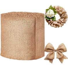 a large roll of burlock next to a wreath and two bows on a white background