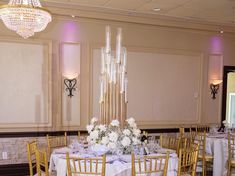 a banquet room set up with tables and chairs