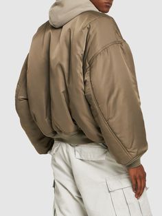 Non-detachable jersey hood. Front zip closure. Ribbed cuffs and hem. Two front flap pockets. One sleeve zip pocket. One sleeve flap patch pocket. Model is wearing a size2 Urban Streetwear Parka With Padded Collar, Urban Style Puffer Jacket For Streetwear, Urban Puffer Jacket With Pockets For Streetwear, Urban Style Parka With Padded Collar For Streetwear, Urban Parka With Padded Collar For Streetwear, Sporty Hooded Puffer Jacket With Pockets, Urban Style Parka With Padded Collar, Techwear Hooded Windbreaker With Ribbed Cuffs, Hooded Techwear Windbreaker With Ribbed Cuffs