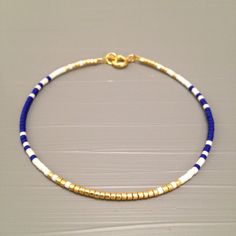 dainty jewelry Dainty Bracelet Delicate Gold Bracelet Gold Bead Bracelet Minimalist Blue Jubilee Bracelet, Blue Minimalist Jubilee Bracelet, Blue Heishi Beads Bracelet With Gold Beads, Blue Heishi Beads Bracelet With Gold Accents, Dainty Gold Heishi Beads Jewelry, Elegant Blue Friendship Bracelets With Colorful Beads, Blue Bracelets With Gold Beads In Dainty Style, Dainty Heishi Bead Bracelets With Gold Beads, Blue Tiny Beads Bangle Jewelry