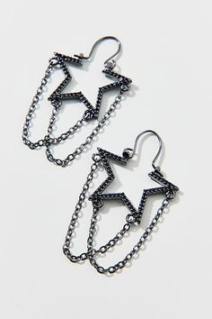 Star hoop earrings with tonal draped chains for an added edge. Features Star chain hoop earrings Statement star earrings Draped chain trim Latch closure Content + Care Mixed metal Avoid contact with water Imported | Star Chain Hoop Earring in Black, Women's at Urban Outfitters Chain Hoop Earrings, Star Hoop Earrings, Men's Shoes Accessories, Star Chain, Wellness Gifts, Women Men Shoes, Brand Sale, Earrings Statement, Mixed Metals