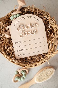 a bird's nest with personalized name tags and spoons next to it