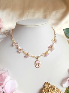 The butterfly is associated with change and metamorphosis, and holds a special place in the hearts of romantics as a symbol of beauty and transformation. This necklace features a dainty butterfly pendant, and to match, soft colours are used to give it an ethereal quality. 🌸Handcrafted with rose quartz, crystal beads, glass seed beads, gold-plated brass, stainless steel findings and tarnish resistant copper wire. 🌸All variations come with a 5cm extender. Butterfly Charm Jewelry For Birthday, Pink Butterfly Charm Pendant Necklace, Pink Pendant Necklace With Butterfly Charm, Dainty Pink Butterfly Necklace As A Gift, Dainty Pink Butterfly Necklace For Gift, Dainty Pink Butterfly Necklace As Gift, Pink Butterfly Dainty Necklace, Pink Butterfly Charm Necklace For Gift, Pink Butterfly Necklace For Gift