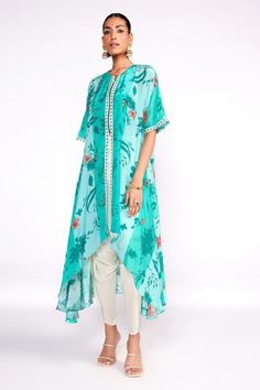 Aqua green crepe front-open kaftan tunic with floral print and cutdana and sequins embroidered placket. Comes with tulip pant and a silk bustier.
Components: 3
Pattern: Printed, Embroidered
Type Of Work: Floral, Cutdana, Sequins
Neckline: Round
Sleeve Type: Half
Fabric: Crepe, Bustier : Silk, Lining : Crepe
Color: Green
Other Details: 
Attached lining
Model Height : 5 ft 8 inches, wearing size S
Closure : Tunic - Front zip
Occasion: Sangeet - Aza Fashions Green Bohemian Short Sleeve Set, Bohemian Green Short Sleeve Set, Green Georgette Kaftan For Eid, Green Palazzo Set With Sheer Dupatta For Summer, Green Kaftan With Printed Motifs, Green Georgette Summer Kurta, Green Printed Motifs Kaftan For Summer, Green Tunic Kaftan With Dupatta, Green Summer Kurta With Sheer Dupatta