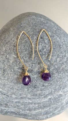 "The perfect everyday earring! This beautiful earring is handmade with either sterling silver or gold filled wire and a natural faceted teardrop amethyst. Completely hypoallergenic and tarnish resistant. Perfect to dress up, but can also be dressed down with jeans and a tee shirt. The stones measure approximately 1/2\" and hang from a 2\" open ear wire. *I can make the ear wire longer or shorter if you need. Please message me for custom length. *Custom colors are also available upon request. Ple Affordable Faceted Teardrop Beaded Earrings, Elegant Gold Amethyst Hoop Earrings, 14k Gold Filled Teardrop Earrings, 14k Gold Filled Teardrop Earrings For Gift, 14k Gold-filled Gemstone Drop Earrings, Handmade Amethyst Teardrop Earrings As Gift, 14k Gold Filled Gemstone Drop Earrings, Handmade Amethyst Teardrop Earrings For Gift, Amethyst Gemstone Teardrop Earrings Gift