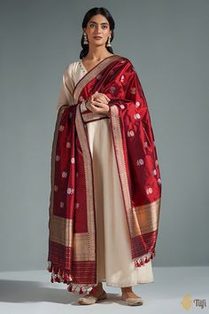 "Only the hands of a master craftsmen can recreate the splendour\u00a0of a blooming rose on silk. This is an enchanting dupatta, lovingly handwoven in Banaras.\u00a0\n\n\n\n\n Color\u00a0-\u00a0A\u00a0regal shade of\u00a0deep Maroon\n\n Technique\u00a0-  An enduring Kadwa weave and fine Meenakari technique. The elaborate and laborious Kadwa (Kadhua) technique involves hand-weaving each motif separately. It takes longer on the handloom, but makes a more robust pattern, which stands out on the fab White Suit With Red Dupatta, Paithani Kurti, Silk Suits Designs Latest, Churidar Designs Latest, Eid 2024, Eid Outfit Ideas, Bridal Suits, Aditi Rao, Indian Bride Outfits