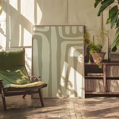 a chair sitting on top of a tiled floor next to a potted plant