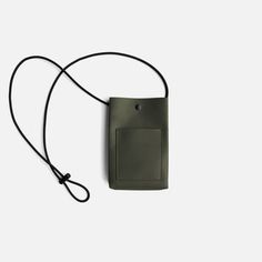 an olive green cell phone case with a lanyard attached to the back, on a white background