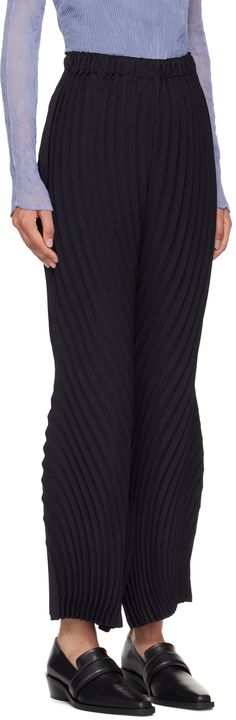 Lightweight wide-leg hand-pleated polyester canvas trousers. · Elasticized waistband · Two-pocket styling · Curved outseams Supplier color: Midnight navy Wide Leg Bottoms With Folds, Chic Wide Leg Bottoms With Folds, Wide Leg Bottoms With Folds For Workwear, Navy Pleated Bottoms For Spring, Spring Navy Pleated Bottoms, Elegant Navy Wide Leg Pants, Pleated Trousers, Midnight Navy, Issey Miyake