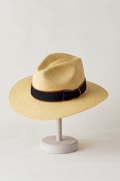 Wherever you're going, you'll be noticed and protected in the Chateau Fedora hat. Hand woven of lightweight, bleached straw from Ecuador, this dashing hat keeps you cool, ventilated, and shaded from the sun with its 3" downturn brim. The pinch-front crown is accented with a grosgrain ribbon finished with a bow, and the interior sweatband lends a soft, stretchy feel to everyday wear. Casual Toquilla Straw Panama Hat For Warm Weather, Beige Panama Hat For Outdoor With Short Brim, Beige Panama Hat With Short Brim For Outdoor, Panama Hat With Upf 50+ And Curved Brim, Kentucky Derby Lightweight Short Brim Sun Hat, Classic Summer Sun Hat For Outdoor, Classic Summer Sun Hat For Outdoors, Lightweight Short Brim Sun Hat For Kentucky Derby, Kentucky Derby Fedora Sun Hat With Uv Protection