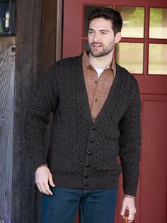 You'll stay warm and look great in this classic Irish cardigan. It's knit with traditional stitching, including a classic cable stitch, representing a fisherman's rope that's thought to bestow good luck throughout life's journey. The pure wool is soft and insulating - and never itchy. Details include a V-neck and two patch pockets. Expertly knit and finished by hand Honeycomb, cable, and basketweave stitches Rib-knit neckline and bottom hem Two front pockets Approx. 27" long 100% Merino wool Han Classic Long Sleeve Cardigan For Cold Weather, Classic Brown Knitted Outerwear, Classic Knitted Brown Outerwear, Classic Knitted Outerwear For Cold Weather, Classic Long Sleeve Cable Knit Outerwear, Classic Cable Knit Cardigan For Fall, Classic Knitted V-neck Sweater For Winter, Classic Sweater Coat With Button Closure, Classic Winter Cable Knit Outerwear