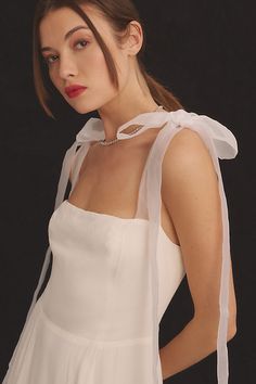 Airy and elegant, the Kairo is a fitted, midi A-line dress with a straight neckline and smocked back bodice. It features organza tie straps, so you can adjust it to your liking.