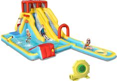 an inflatable water slide with people on it and a yellow blow up pool