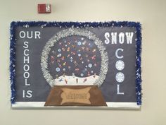 a bulletin board with a snow globe on it and the words our school is cool