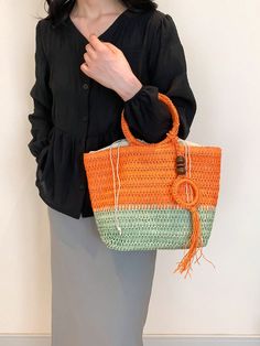 Stay stylish and organized this spring and summer with our Chic and Colorful Woven Tote Bag. Featuring a circular handle design and vibrant colors, this bag is perfect for any occasion. With ample space and a durable woven construction, it's the ultimate accessory for all your needs. Color : Multicolor Type : Straw Bag Bag Size : Large Style : Casual, Vacation Strap Type : Chain Closure Type : Zipper Pattern Type : All Over Print Composition : 60% Polyester, 40% Polyvinyl Chloride Material : Fab Trendy Straw Bag With Round Handle For Spring, Spring Large Capacity Handheld Straw Bag, Spring Beach Bag With Braided Handles, Spring Bucket Shoulder Bag With Handles, Trendy Summer Bags With Round Handle, Spring Handheld Beach Bag With Braided Handles, Eco-friendly Straw Bag With Detachable Handle For Beach, Green Handheld Bucket Bag With Large Capacity, Eco-friendly Handheld Shoulder Bag For Summer