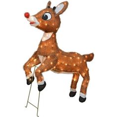 a lighted reindeer sitting on top of a chair