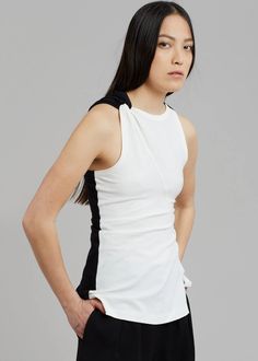 JW Anderson Twisted Split Hem Tank - Off White – The Frankie Shop Fitted White Asymmetrical Tops, Fitted Asymmetrical White Tops, White Asymmetrical Tops For Workwear, White Asymmetrical Tops For Work, White Asymmetrical Stretch Tops, White Sleeveless Top With Minimal Stretch, White Minimal Stretch Sleeveless Top, The Frankie Shop, Frankie Shop