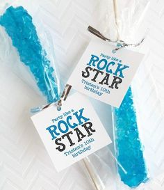 two blue rockstar lollipops are wrapped in plastic