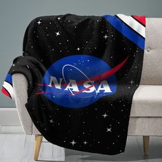 the nasa blanket is sitting on a chair