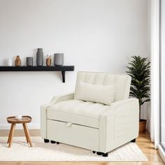 a living room with a white chair and coffee table in front of a wall mounted shelf