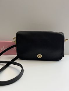 "Vtg Coach Original  Pocket Purse Black leather with brass hardware Roomy interior with one inner slip pocket and one outer slip pocket covered by a flap and secured with a turnlock Outer back pocket Removable 39\" strap  When strap is removed it can be worn as a clutch or replaced with other straps  Hang tag and chain Measures: 9.5\"L, 6\"H, 2\"W Made in the United States #419-9394 Cleaned, conditioned and ready to wear! Questions? Just ask More vintage coach styles/colors are also available b2 Classic Evening Shoulder Bag With Cc Turnlock Closure, Classic Formal Double Flap Bag, Rectangular Flap Bag With Cc Turnlock Closure, Classic Double Flap Shoulder Bag With Cc Turnlock Closure, Classic Leather Bag With Cc Turnlock Closure, Classic Shoulder Bag With Cc Turnlock And Double Flap, Classic Flap Bag With Cc Turnlock Closure, Black Satchel With Cc Turnlock Closure, Timeless Flap Bag With Cc Turnlock Closure