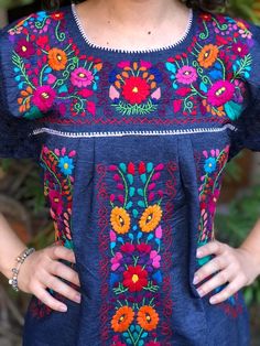 Beautiful denim dress embroidered by hand by artisans from the state of Oaxaca, Mx. comfortable and fresh, with lace details and drawstring to adjust at the waist. The embroidery is unique to each dress so it may vary. Mexican textile art has centuries of history and creativity throughout the country. Mexico is recognized as one of the leading countries with a beautiful artistic production in the textile world, miraculous hands of talented artisans from different states of the country create stu Blanket Dress, Mexican Sandals, Mexican Textiles, Vintage Cowboy Boots, Vintage Cowboy, Mexican Dresses, Ethnic Dress, Embroidered Dress, Lace Detail