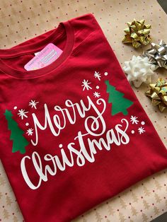 Christmas t-shirt , great for Christmas gift, family matching t-shirt, Christmas events  t-shirt : is unisex , stretch , very soft material  multiple colors available , please select one  also a variety of colors   PLEASE READ: white t-shirt will have red letters and green trees  the rest of the colors will come white as the sample with green trees   feel free to message me if you have  any questions  thank you for stopping by -----Marthalovescraft----- Christmas Shirts Vinyl, Diy Christmas Shirts, Christmas Tree Red, Unisex Christmas Gifts, Cricut Christmas Ideas, Christmas Shirts For Kids, Red Letters, Christmas T Shirt Design, Christmas Events