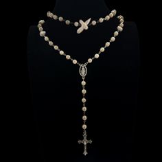 Follow @cherubtrove on Instagram for latest products and more information. ꣑ৎ Handmade goth cross necklace with glass pearls, baroque freshwater pearls, silver details & a silver cross charm. Adjustable length. Introducing our stunning silver cross necklace, a perfect blend of style and spirituality. This handmade necklace features a unique design that captures the essence of y2k grunge jewelry, making it an ideal accessory for anyone looking to express their individuality. With its gorgeous white pearl rosary and intricate silver cross pendant, this gothic rosary can not only be a religious necklace but also a fashionable piece of art. Whether you're layering it with other punk necklaces or wearing it alone, this one-of-a-kind pearl cross necklace will elevate your style. Beautiful silver Beeded Cross Necklace, Grunge Jewelry Necklaces Pearl, Hand Made Cross Necklace, Goth Cross, Pearl Cross Necklace, Necklace Y2k, Goth Necklace, Grunge Jewelry, Silver Cross Necklace