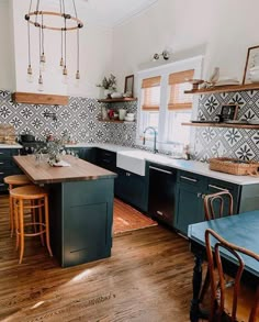 the kitchen is clean and ready to be used for cooking or baking, while the dining room table has been set up