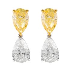 Sensational and important fancy intense yellow and white diamond drop earrings. Incredibly rare to match such stones, a piece like this is typically seen only in the major high jewelry house and major auction houses. Each stone GIA certified. High jewelry by Alexander Beverly Hills. 18.15 carats total diamond weight. Two top matching pear shape yellow diamonds, 8.10 carats total. Both Fancy Intense Yellow color and SI1 clarity. Two matching pear shape white diamonds diamonds 10.05 carats total. Luxury Gia Certified White Diamond Earrings, White Diamond Earrings, Yellow Diamonds, Expensive Jewelry, Diamond Drop Earrings, Diamond Drops, Modern Earrings, Dream Jewelry, Yellow Diamond