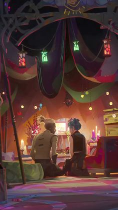 two people sitting on the ground in front of a room with many lights and decorations