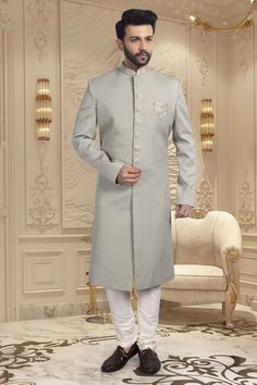 Introducing our latest masterpiece, the Mens Sherwani R14-S65. Made with a delicate pastel color, this sherwani exudes elegance and sophistication. Perfect for special occasions and formal events, this sherwani with unique design make you stand out in the crowd and elevate your style to a whole new level. Luxury Bandhgala For Groom, Elegant Sherwani With Chikankari Embroidery, Elegant Sherwani With Chikankari Embroidery In Traditional Drape, Designer Cream Kurta For Formal Occasions, Elegant Cream Sherwani With Dabka Detailing, Elegant Traditional Wear With Dabka For Reception, Elegant Kurta With Naqshi In Traditional Drape, Elegant Eid Bandhgala With Chikankari Embroidery, Elegant Nehru Jacket With Zari Work