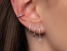 ✨Our Silver Pierced Earring Set is stylish, minimal Style. This Stacking Earring Set is perfect for every day but can also complement a party outfit. This ear stack is a great gift option. Mix and match, you will never get bored of it! :) ✨Product specifications:  * Material: Sterling Silver with Zircon stone.  * Hoops Diameter (inner): 7mm.  * Hoops width: 2mm. ✨✨FREE PERSONALISED GIFT POUCH WITH EVERY ORDER Select a gift pouch colour (lilac or cream - refer to the last photo for guidance) and make it your own by adding up to 10 letters or numbers as a personal touch. I will gladly include a gift message. ✨Care instructions: * Avoid contact with perfumes, lotions, sunscreens etc.  * Cleaning your jewellery: A wipe with a microfiber cloth will remove most dust or dirt. ( Microfiber cloth w Three Hoop Ear Piercings, Silver Earrings Set Aesthetic, Silver Stud Earring Stack, Silver Ear Stack Ideas, 3 Ear Piercings In A Row, Styled Ear Piercings Silver, Stacked Earrings Silver, Silver Earscapes, Earring Stack Ideas 3 Holes