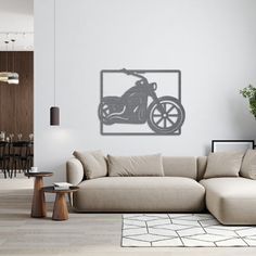 a living room filled with furniture and a large wall mounted motorbike on the wall