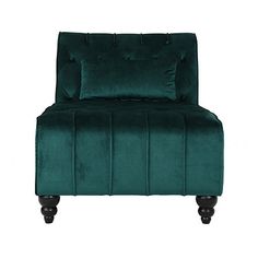 a green velvet chair with black legs and buttons on the back, sitting against a white background