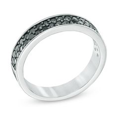 a white gold ring with black diamonds