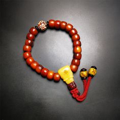 ❤This bone mala bracelet was made by Tibetan craftsmen and come from Hepo Town, Baiyu County, the birthplace of the famous Tibetan handicrafts. Its circumference is 20cm, 24 beads in round, including 23 brown yak bone beads with a diameter of 11mm, a cloud dzi bead with a diameter of 14mm, a yak bone guru bead with a length of 22mm, and 2 yak bone dice hanging from the tail. ❤These amazing bone beads are handcrafted by artisans from Tibet,who recycle and reuse everything in daily life and spirit Traditional Handmade Beaded Bracelets For Meditation, Handmade Brown Beaded Bracelets For Ceremonial Use, Handmade Brown Beaded Bracelets For Rituals, Hand-strung Amber Beaded Bracelets For Meditation, Spiritual Brown Beaded Bracelets For Rituals, Amber Beaded Bracelets For Meditation, Spiritual Wooden Beads Bracelets For Festivals, Traditional 8mm Beads Bracelets For Meditation, Traditional 108 Beads Bracelet For Festivals