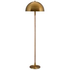 a brass colored floor lamp on a white background