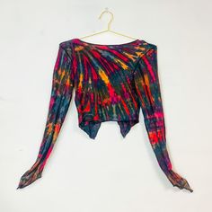 Hippie Style Stretch Tops For Beach, Hippie Stretch Tops For Beach, Hippie Stretch Tops For The Beach, Tie Dye V-neck Top For Beach, Colorful Fitted Bohemian Tops, Multicolor Long Sleeve Crop Top For Vacation, Multicolor Long Sleeve Crop Top For Beach, Multicolor Stretch Beachwear Tops, Multicolor Hippie Festival Tops