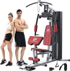 a man and woman standing next to a gym equipment