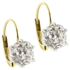 Indulge in the allure of timeless elegance with these exquisite Old Mine Cut Diamond Earrings. Featuring two stunning diamonds weighing 1.66 carats and 1.65 carats respectively, for a total of 3.31 carats, these earrings capture the enchanting brilliance of a bygone era. Each diamond, with a captivating H color and clarity ranging from VS1 to SI1, is securely set in a classic 6-prong setting that enhances its unique sparkle and fire. The old mine cut, known for its charming, slightly irregular s Luxury Vintage Earrings With Single Cut Diamonds, Luxury Platinum Diamond Earrings Hallmarked, Luxury Oval Diamond Earrings For Formal Events, Luxury Oval Diamond Earrings For Formal Occasions, Classic Yellow Gold Diamond Earrings For Evening, Timeless Hallmarked Diamond Earrings For Formal Occasions, Luxury Brilliant Cut Yellow Gold Diamond Earrings, Luxury Yellow Gold Brilliant Cut Diamond Earrings, Luxury Yellow Gold Diamond Earrings With Brilliant Cut