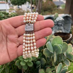 "Antique Victorian Era Five Strands of Old Graduating Pearls Beaded Bracelet with 800 Sterling Silver Ornate Details Slide Lock Clasp, 8 Inches Long.  Overall in good-fair aged condition, old pearls shows surface wears and \"flaws\" in some areas, some have been chipped and looks of peeling. You can tell this piece has been heavily worn, or been through a lot (Lol). Still gorgeous and definitely wearable, does not need to be re-threaded in my opinion.  -Bracelet full wear length measures 8 Inches, Diameter of Graduating pearls, smallest measures 4.7mm, largest measures 7.9mm - Clasp is marked \"800\" and \"GEO\" - Bracelet total weighs 40.9 Grams *Box and props in the picture are not included in this listing, only the bracelet! Thank you. Please feel free to ask any questions! ┊  ┊  ┊  ┊ ┊ Luxury Beaded Pearl Bracelet, Luxury Beaded Pearl Bracelet For Formal Occasions, Luxury White Beaded Pearl Bracelet, Luxury Hand-strung Beaded Bracelets For Formal Occasions, Luxury Beaded Pearl Bracelet For Wedding, Luxury Single Strand Bracelets For Wedding, Luxury Beaded Bracelets With Round Beads For Wedding, Elegant Beaded Bracelet With Sterling Silver Clasp, Elegant Beaded Bracelets With Sterling Silver Clasp