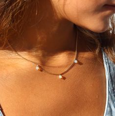 The Siri Necklace features our classic La Mer Chain elevated with three tiny opals! This opal necklace is a delicate stunner to wear alone for a sweet and simple look. If you are ready to switch into a luxe vibe, add our Maren Pearl Necklace for an ultra elegant look! DETAILS Simple Look, Opal Necklace, Gold Filled, Pearl Necklace, Opal, Sterling Silver, Chain, Silver, Gold