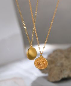 A necklace for lovers of sun, moon and life. Celestial Moon Sun Delicate Round Pendant. Stainless Steel Necklace 18k Gold Plated Chain Trendy Charm Chic Jewelry. Round celestial inspired pendent. Details  Chain Length: 39cm in length  Chain Thickness: 2MM Pendent Thickness 5mm Pendent width: 18mm Pendent Length: 20mm Made from stainless steal and plated in 18k gold. Care Details- Make your jewellery last by caring for them.  Try to remove your jewellery before sleeping, bathing, swimming or exercising to avoid damage. Be considerate of where you spray your perfume and hairspray. Wipe down jewellery with cloth after use.  This item comes with, a pouch and jewellery cloth. All items are packed with love and care.  If more than one item is purchased from the Nora and Jay store the jewellery i Sun And Moon Necklace, Gold Sun, Gold Charm Necklace, Chic Jewelry, Moon Necklace, Round Pendant, Gold Pendant Necklace, Gold Plated Chains, Stainless Steel Necklace