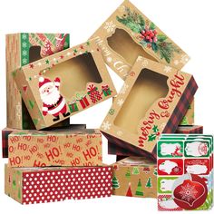 several boxes are stacked on top of each other and decorated with christmas themed designs, such as santa claus